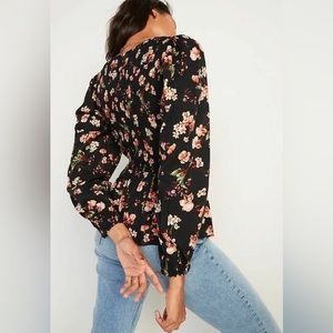 Long sleeve floral peplum top.